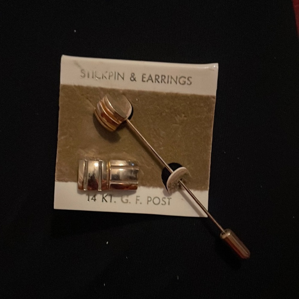 Stick pin and stud earrings